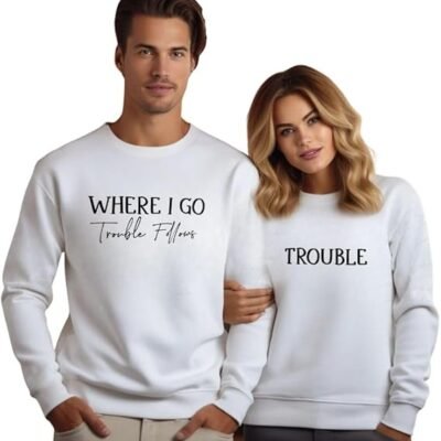 Matching couple sweatshirts in white with playful 'Where I Go Trouble Follows' and 'Trouble' designs, ideal for Valentine's Day or fun gifts