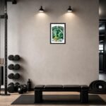 Industrial gym corner with a black bench on a mat, dumbbells on a rack, kettlebell and rope nearby, and a framed green poster on the gray wall under two lights.