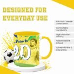 Yellow ceramic mug with a soccer-themed graphic and the number 20, displayed on a white pedestal with a soccer ball beside it, against a splashy yellow background and the phrase 'Designed for Everyday Use' at the top.