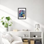 Living room wall with a framed poster labeled Australia above a white shelf, with a plant on the left and a lamp on the right.