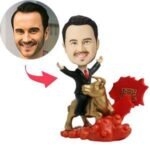 Golden Bull Bobblehead-95d0-4492-b696-ccbd7fe10463jpg