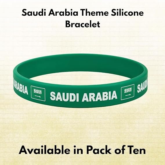 Green silicone bracelet with 'SAUDI ARABIA' printed around it; shown as a theme bracelet, advertised as pack of ten