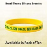 Yellow silicone bracelet with Brazil flag motifs and the word BRAZIL around the band; text above reads 'Brazil Theme Silicone Bracelet' and below 'Available in Pack of Ten'.